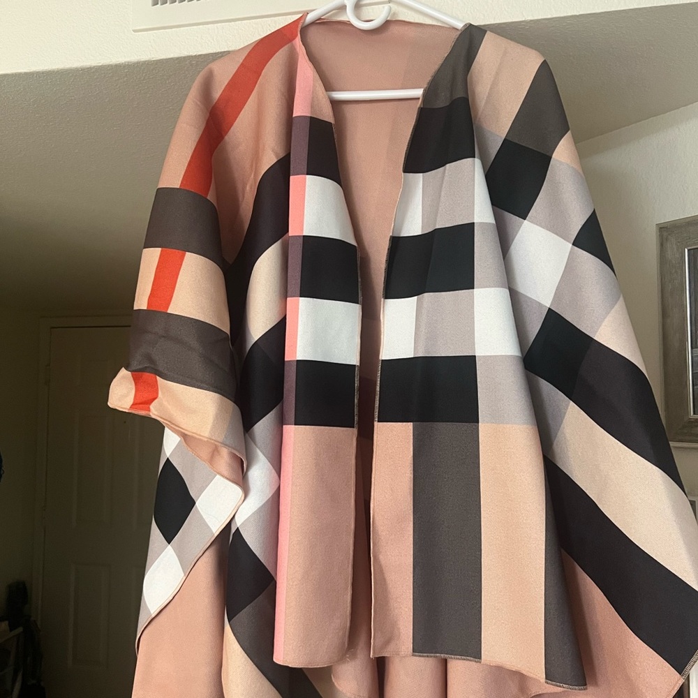 Women’s shawl/wrap Burberry like print No tags. Reversible to camel color new